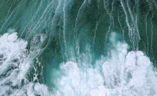 Churned up water with many whitecaps in the sea