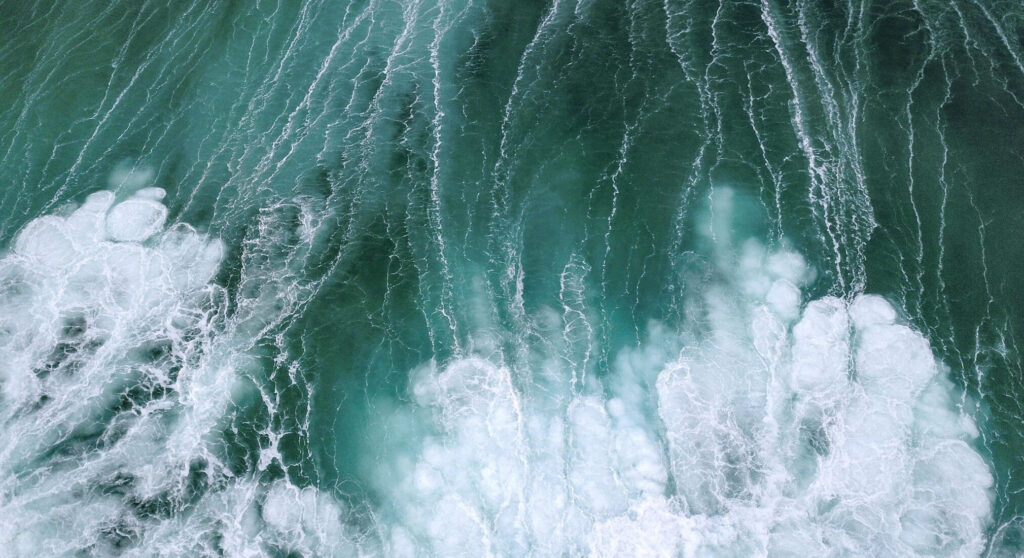 Churned up water with many whitecaps in the sea